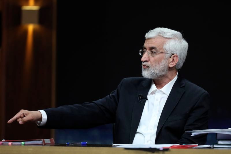 In this photo made available by Iranian state-run TV, IRIB, hard-line candidate for Iran's presidential election Saeed Jalili speaks during a debate with reformist candidate Masoud Pezeshkian at the TV studio in Tehran, Iran, Tuesday, July 2, 2024. Iran will hold a runoff presidential election Friday, only its second since the 1979 Islamic Revolution, after only 39.9% of its voting public cast a ballot the previous week. (Morteza Fakhri Nezhad/IRIB via AP)