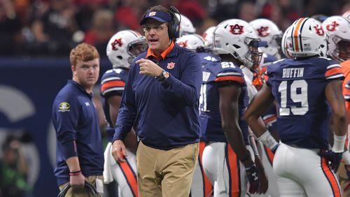 December 2, 2017 Atlanta: Auburn Tigers head coach Gus Malzahn takes a time out with his team during the second half of the SEC Football Championship at Mercedes-Benz Stadium, December 2, 2017, in Atlanta.  Hyosub Shin / hshin@ajc.com