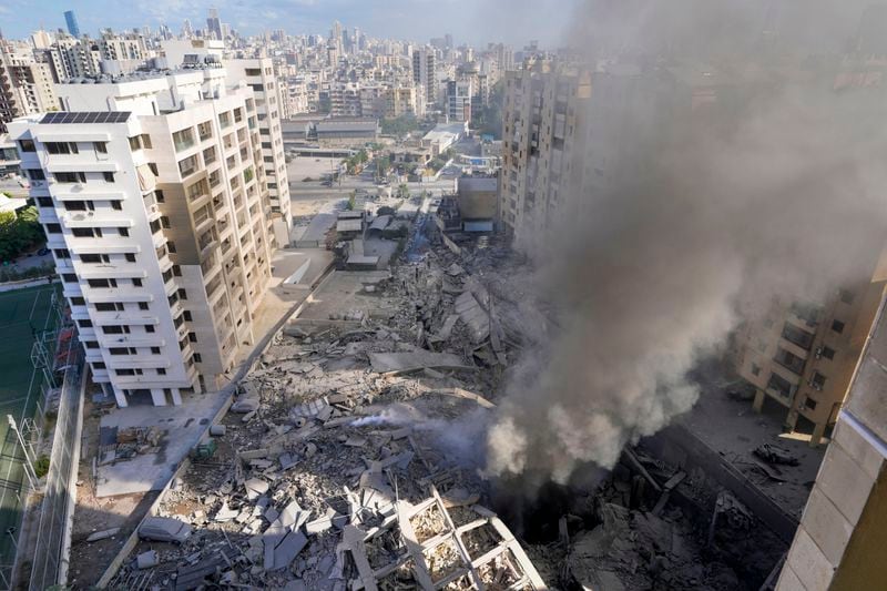 Smoke rises from the site of an Israeli airstrike in Dahiyeh, Beirut, Lebanon, Wednesday, Oct. 2, 2024. (AP Photo/Hassan Ammar)