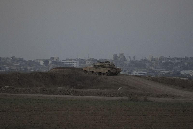 An Israeli tank overlooks the Gaza Strip, as seen from southern Israel, Wednesday, Sept. 11, 2024. (AP Photo/Tsafrir Abayov)