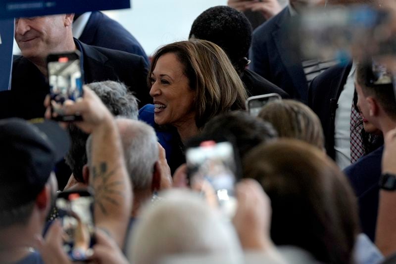 Democratic presidential nominee Vice President Kamala Harris greets supporters as she arrives at Pittsburgh International Airport, Sunday, Aug. 18, 2024, in Pittsburgh. (AP Photo/Julia Nikhinson)