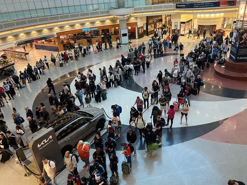 Security lines stretched through Hartsfield-Jackson International Airport's domestic terminal atrium on Monday, May 20, 2024.