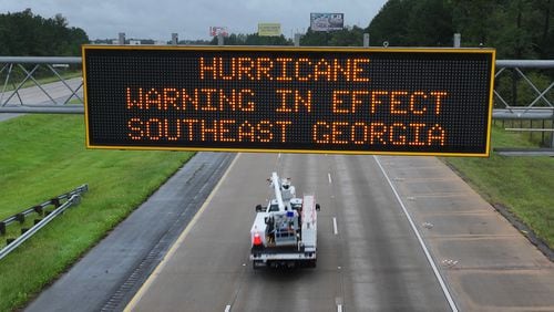 Hurricane warning sign is displayed on I-75 near Adel, Thursday, September 26, 2024. Hurricane Helene is set to make landfall as a major storm in Florida on Thursday evening, bringing rain and damaging wind to Georgia. Emergency officials are warning of fallen trees, downed power lines, shuttered roads and even the possibility of landslides as Helene makes its way through Georgia overnight. (Hyosub Shin / AJC)