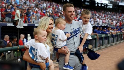 062422 Atlanta: Los Angeles Dodgers first baseman Freddie Freeman gets a moment with his family, wife Chelsea and their three chidlren, after Freeman received his World Series ring before their game against the Atlanta Braves at Truist Park Friday, June 24, 2022, in Atlanta. Former Atlanta Braves first baseman Freddie Freeman returns to Atlanta for the first time since joining the Los Angeles Dodgers. (Jason Getz / Jason.Getz@ajc.com)
