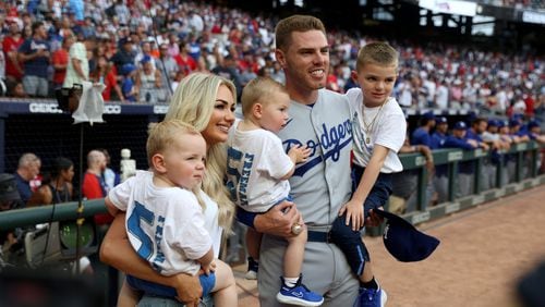 Los Angeles Dodgers first baseman Freddie Freeman poses with his wife, Chelsea, and their three children, after Freeman received his World Series ring before facing his former teammates at Truist Park on June 24, 2022. (File photo by Jason Getz / Jason.Getz@ajc.com)