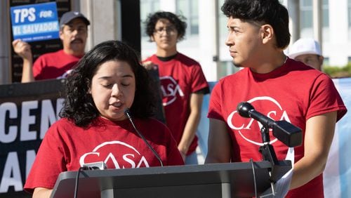 TPS activists Alberto Feregrino (L) and Stephanie Contreras talk at a press conference at liberty plaza near the state capital Thursday, September 15, 2022.   Steve Schaefer/steve.schaefer@ajc.com)