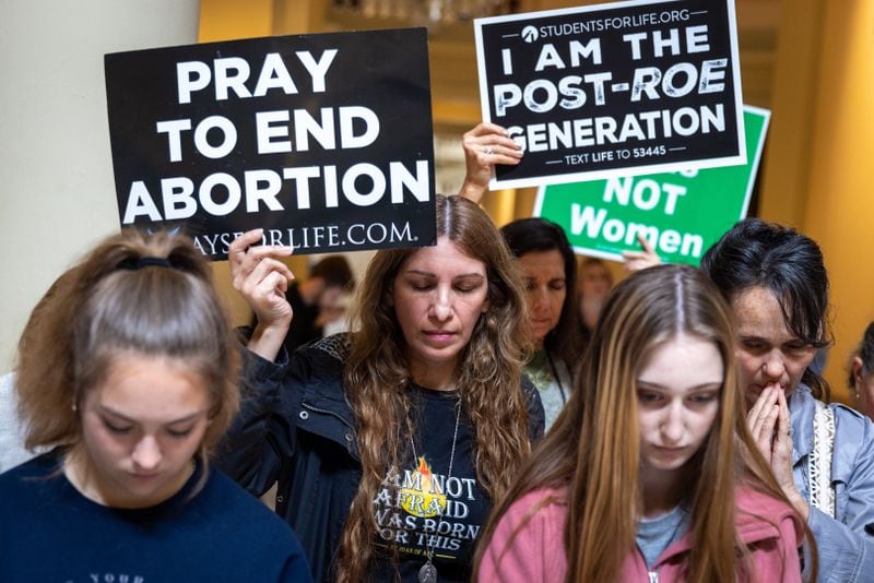 Anti-abortion activists pray at an anti-abortion rally at the Georgia State Capitol in Atlanta on Feb. 9, 2023. (Arvin Temkar/AJC)