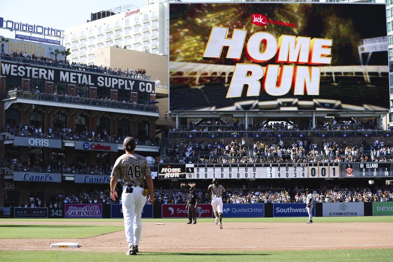 San Diego Padres' Fernando Tatis Jr., center, runs the bases after hitting a solo home run against the Chicago White Sox in the eighth inning of a baseball game Sunday, Sept. 22, 2024, in San Diego. (AP Photo/Derrick Tuskan)