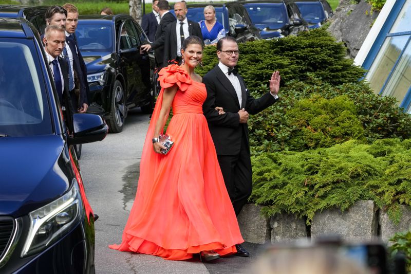 Sweden's Crown Princess Victoria and Prince Daniel of Sweden attend the wedding of Norway's Princess Martha Louise and Durek Verrett, in Geiranger, Norway, Saturday Aug. 31, 2024. (Cornelius Poppe/NTB via AP)