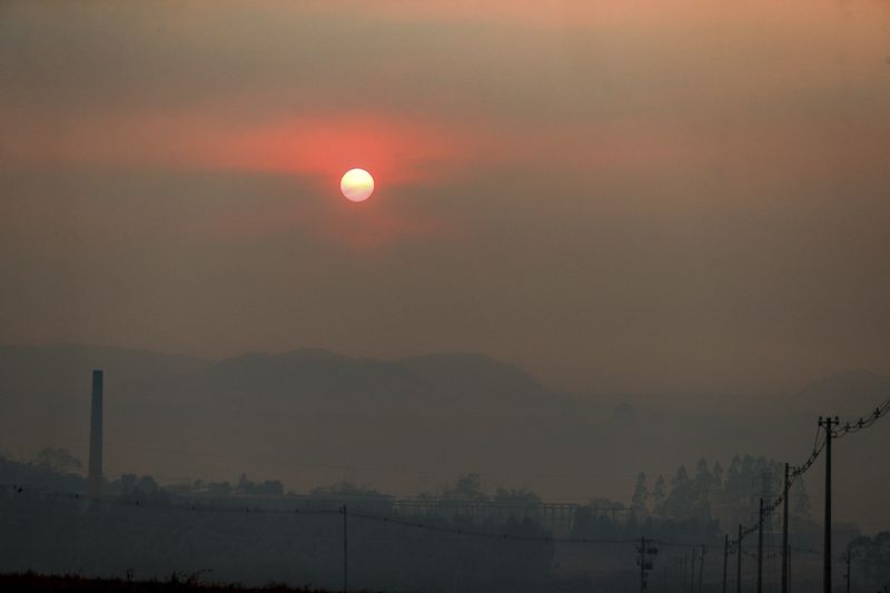 Smoke from wildfires fills the air in Ribeirao Preto, Sao Paulo state, Sunday, Aug. 25, 2024. (AP Photo/Marcos Limonti)