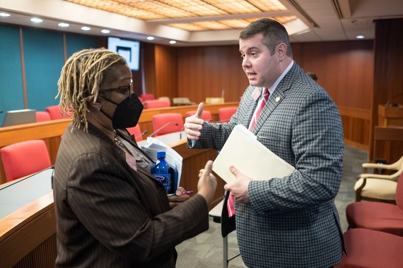 Democratic state Rep. Doreen Carter of Lithonia, who opposed legislation involving the teaching of "divisive concepts," talks to the bill's sponsor, Republican state Rep. Will Wade of Dawsonville. Ben Gray for the Atlanta Journal-Constitution