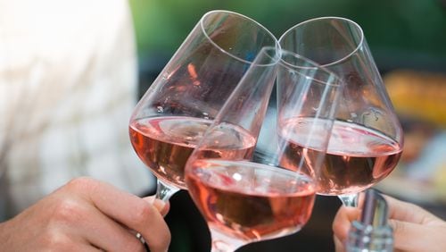 Chilled pink wine on a hot summer night is still the Instagram symbol of summer. (Dreamstime/TNS)