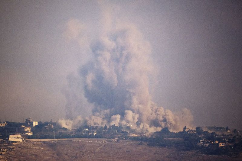 Smoke rises following an explosion in southern Lebanon as seen from northern Israel, Monday, Oct. 7, 2024. (AP Photo/Leo Correa)