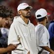 Atlanta Hawks NBA basketball player Trae Young, center left, watches as Oklahoma plays Houston during the second half of an NCAA college football game Saturday, Sept. 7, 2024, in Norman, Okla. (AP Photo/Alonzo Adams)