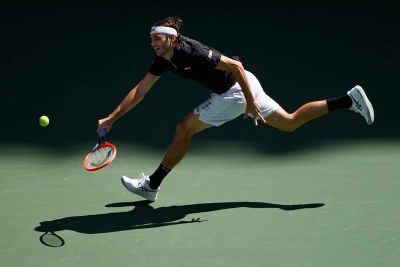 Taylor Fritz, of the United States, returns a shot to Alexander Zverev, of Germany, during the quarterfinals of the U.S. Open tennis championships, Tuesday, Sept. 3, 2024, in New York. (AP Photo/Pamela Smith)