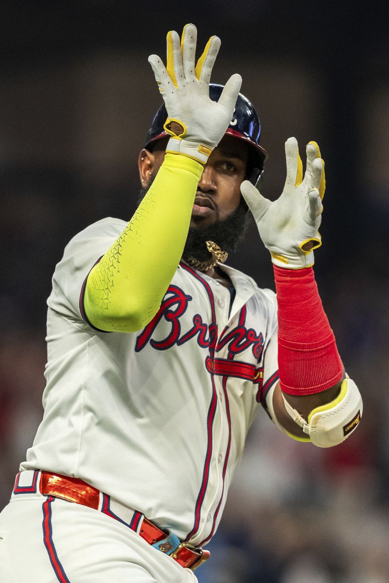 Atlanta Braves' Marcell Ozuna celebrates on the way to first base after hitting a home run in the fifth inning of a baseball game against the New York Mets, Tuesday, Sept. 24, 2024, in Atlanta. (AP Photo/Jason Allen)