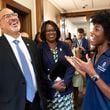 U.S. Secretary of Education Miguel Cardona laughs while listening to rising sophomore Kennedy Rogers during a tour of Spelman College in Atlanta on Wednesday, July 17, 2024. (Ben Gray / Ben@BenGray.com)