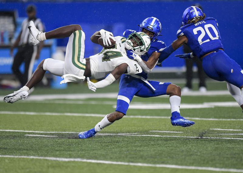 Georgia State tackles Charlotte's Grant DuBose (14) as he carries the ball in the first half of play Saturday, Sept. 18, 2021 at Center Parc Stadium in Atlanta. (Daniel Varnado/For the AJC)