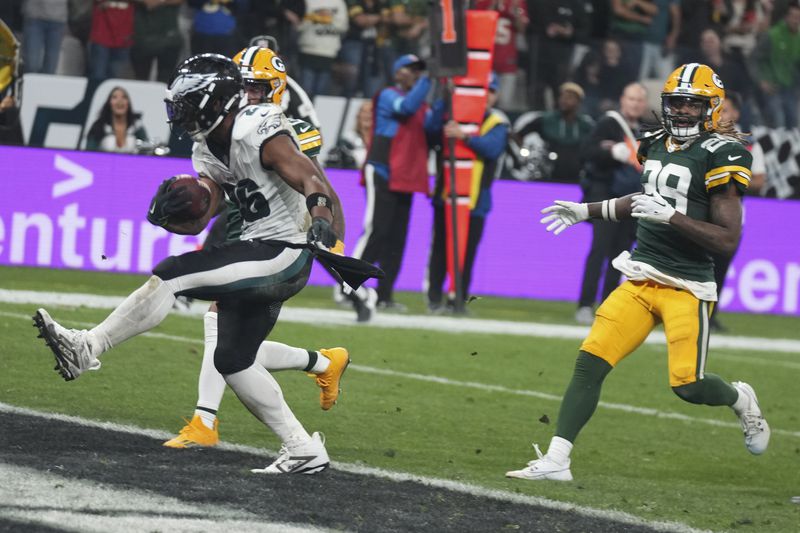 Philadelphia Eagles running back Saquon Barkley (26) celebrates after scoring against the Green Bay Packers during the first half of an NFL football game, Friday, Sept. 6, 2024, at the Neo Quimica Arena in Sao Paulo. (AP Photo/Fernando Llano)