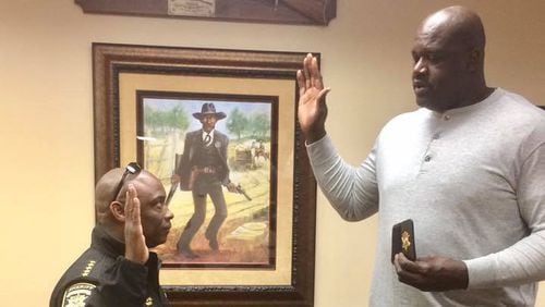 Clayton County Sheriff Victor Hill posted these photos of him swearing in Shaquille O'Neal as a deputy in 2016.