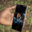 Moustapha Sabally displays a photo of his son who is a doctor in America on his mobile phone in the village of Kwinella, Gambia, on July 27, 2024. ( AP Photo/Annika Hammerschlag)