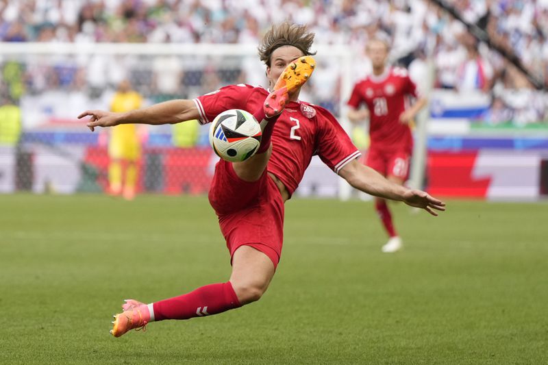 Denmark's Joachim Andersen attempts to control the ball during a Group C match between Slovenia and Denmark at the Euro 2024 soccer tournament in Stuttgart, Germany, Sunday, June 16, 2024. (AP Photo/Matthias Schrader)