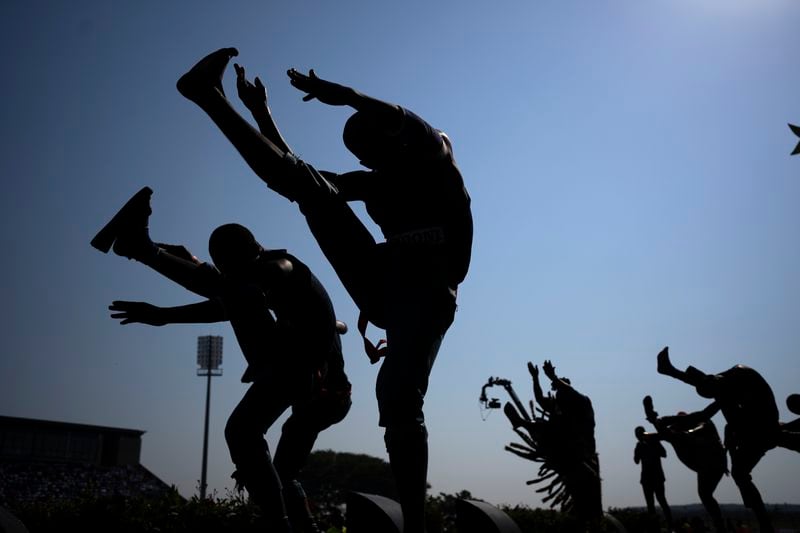 Supporters of Inkatha Freedom Party dance during an election rally in Richards Bay, near Durban, South Africa, Sunday, May 26, 2024, in anticipation of the 2024 general elections scheduled for May 29. (AP Photo/Emilio Morenatti)