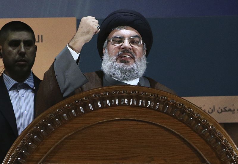 FILE - Hezbollah leader Hassan Nasrallah speaks during a rally to mark Jerusalem day, in Beirut's southern suburb, on Aug. 2, 2013. (AP Photo/Hussein Malla, File)