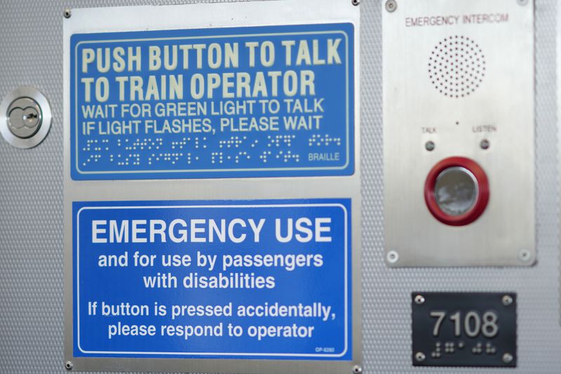 An emergency communication panel is seen on a Chicago Transit Authority Blue Line train Tuesday, Sept. 3, 2024, in Forest Park, Ill. (AP Photo/Charles Rex Arbogast)