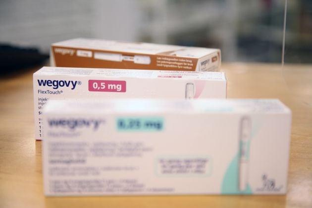 Various packages of the weight-loss drug 'Wegovy' from the pharmaceutical company Novo Nordisk lie on the sales counter in a Danish pharmacy. (Steffen Trumpf/dpa via ZUMA Press/TNS)