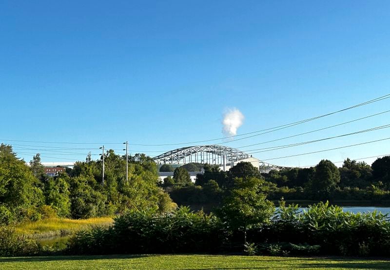 The Piscataqua River Bridge is shown in Portsmouth, N.H., after a man connected to a homicide was fatally shot by police and an 8-year-old child was found shot to death in the man’s car on the bridge that connects New Hampshire to Maine, Thursday, Aug. 29, 2024. An 8-year-old child was found shot to death in the man's car, the attorney general's office said Thursday. (AP Photo/Caleb Jones)