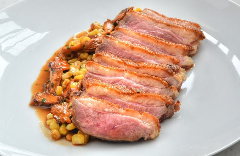 Roast duck with chanterelles and corn at Lucian Books and Wine. (Chris Hunt for The Atlanta Journal-Constitution)