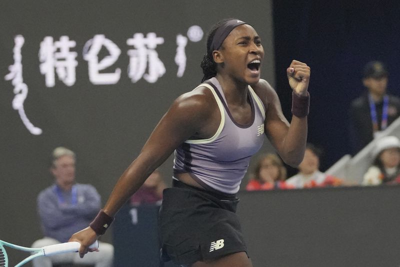 Coco Gauff of the United States reacts during her women's singles final match against Karolina Muchova of Czech Republic at the China Open tennis tournament at the National Tennis Center in Beijing, Sunday, Oct. 6, 2024. (AP Photo/Achmad Ibrahim)