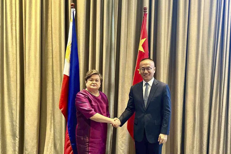 In this handout photo provided by the Philippine Department of Foreign Affairs, Philippine Foreign Affairs Undersecretary Ma. Theresa P. Lazaro, left, and Chinese Vice Foreign Minister Chen Xiaodong shake hands during the Philippines and China 9th Meeting of their Bilateral Consultation Mechanism on the South China Sea in Manila, Philippines, Tuesday July 2, 2024. China and the Philippines held a crucial meeting Tuesday to try to ease escalating tensions following their worst confrontation in the disputed South China Sea that caused injuries to Filipino navy personnel, damaged two military boats and sparked fears of a wider conflict that could involve Manila's treaty ally the United States. (Department of Foreign Affairs via AP)
