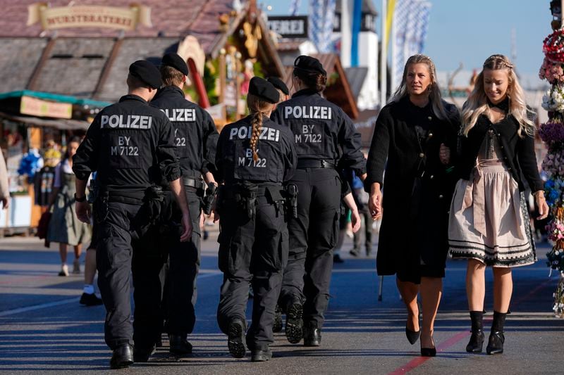 Police patrols before the start of the 189th 'Oktoberfest' beer festival in Munich, Germany, Saturday, Sept. 21, 2024. (AP Photo/Matthias Schrader)