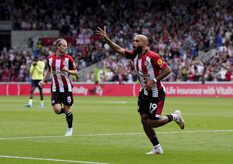 Brentford's Bryan Mbeumo celebrates scoring during the English Premier League soccer match between Brentford and Southampton at the Gtech Community Stadium, London, Saturday Aug. 31, 2024. (Aaron Chown/PA via AP)