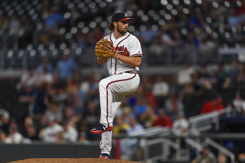 Atlanta Braves shortstop Charlie Culberson pitches in relief in the ninth inning of a baseball game against the Colorado Rockies in Atlanta, Friday, Aug. 17, 2018. The Rockies won 11-5. (AP Photo/Danny Karnik)