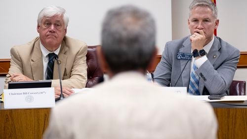 Sen. Bill Cowsert, left, (R-Athens) chair of the Senate Special Committee on Investigations, and Sen. John Kennedy (R-Macon) listen to testimony from former Gwinnett District Attorney Danny Porter during a hearing at the State Capitol on Friday, Aug. 9, 2024.   (Ben Gray / Ben@BenGray.com)