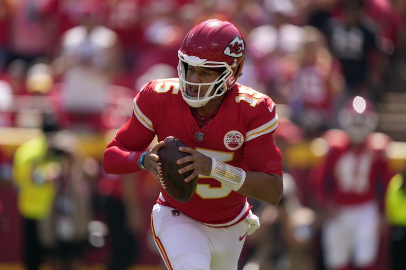 Kansas City Chiefs quarterback Patrick Mahomes (15) rolls out to pass against the Detroit Lions during the first half of an NFL preseason football game Saturday, Aug. 17, 2024, in Kansas City, Mo. (AP Photo/Charlie Riedel)