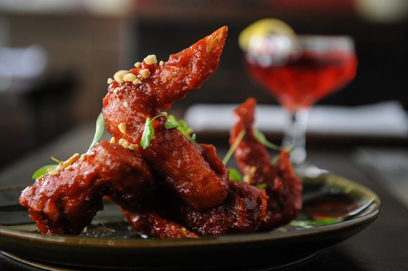 Sweet and Spicy Korean Fried Chicken Wings and a No Brain cocktail made with Svedka vodka, Tiger Eyes byejoe, ginger, lemon and hibiscus. (BECKY STEIN PHOTOGRAPHY)
