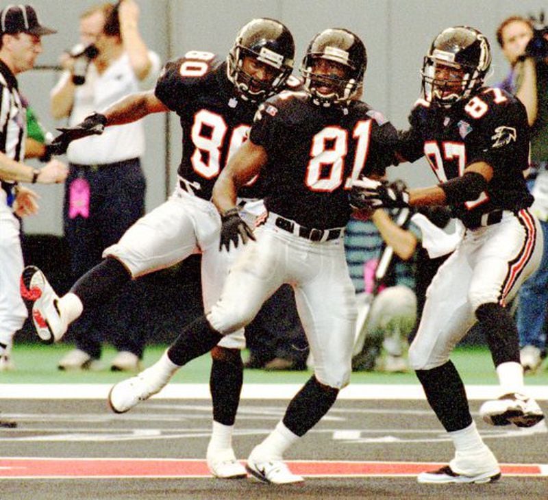 Receivers Andre Rison (80), Terance Mathis (81) and Bert Emanuel celebrate a score in 1994.