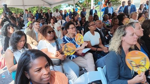 A crowd gathered under a tent outside the Oak Hill Child, Family & Adolescent Center at 2805 Metropolitan Parkway SW for the Aug. 8, 2024, ribbon-cutting on a new public behavioral health crisis center.