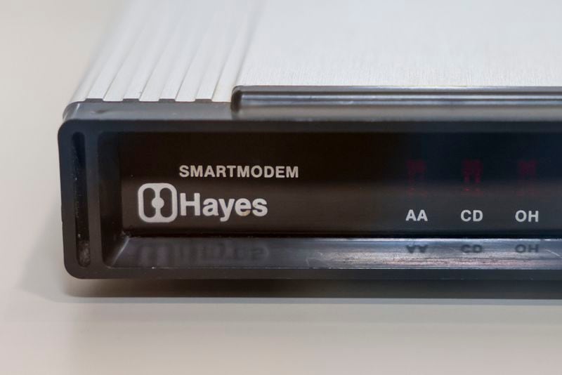 The Hayes Smartmodem, initially designed to fit under the base of a landline phone, is nestled between cases at the Computer Museum of America in Roswell. (Jason Getz / jason.getz@ajc.com)