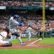 Kansas City Royals' Bobby Witt Jr. (7) hits in an RBI single during the sixth inning of Game 1 of an AL Wild Card Series baseball game against the Baltimore Orioles, Tuesday, Oct. 1, 2024, in Baltimore. (AP Photo/Stephanie Scarbrough)