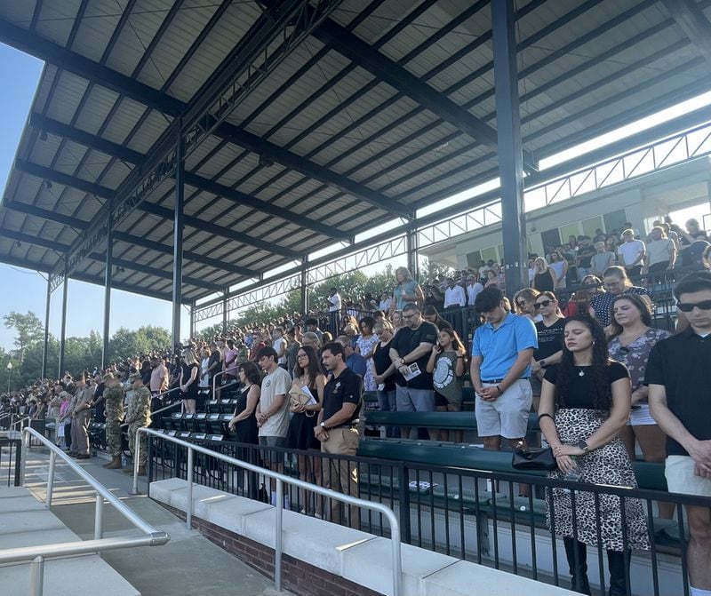 Spectators watching Fort Moore’s recent infantry graduation weighed in on the fierce debate over the vice presidential candidates' military experience. For some voters, wearing the uniform is enough. Jeremy Redmon / jeremy.redmon@ajc.com