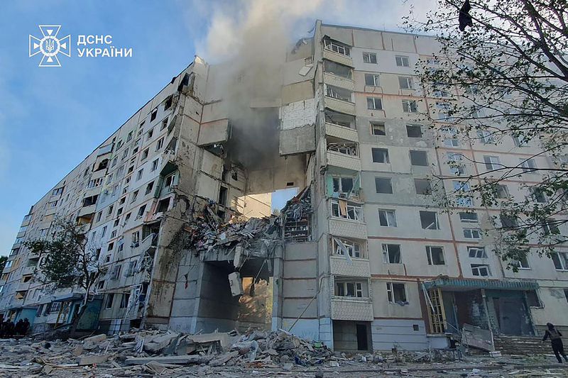 Smoke, dust and debris can be seen after after a Russian attack that hit a residential building in Kharkiv, Ukraine, Tuesday Sept. 24, 2024. (Ukrainian Emergency Services via AP)