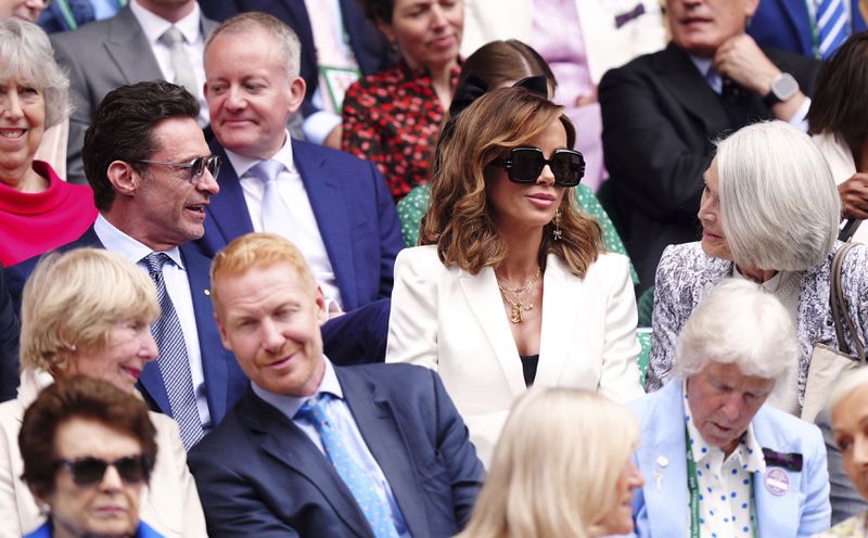 Hugh Jackman and Kate Beckinsale in the royal box on day thirteen of the Wimbledon Championships at the All England Lawn Tennis and Croquet Club in London, Saturday July 13, 2024. (Mike Egerton/PA via AP)