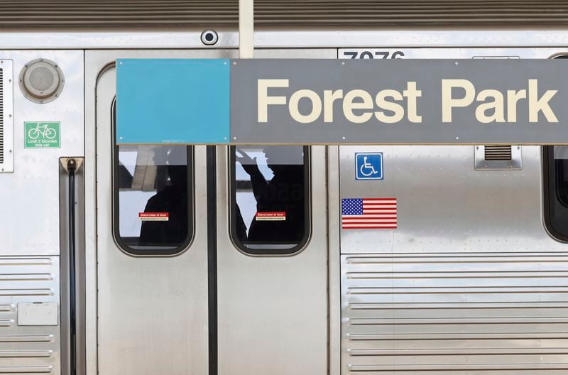 Police investigators work inside a CTA Blue Line train parked at the Forest Park station after a shooting, Monday, Sept. 2, 2024, in Forest Park, Ill. (John J. Kim/Chicago Tribune via AP)