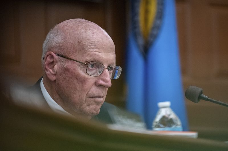 Daniel E. Wathan, Chair of the Independent Commission to Investigate the Facts of the Tragedy in Lewiston listens to Maine State Police Col. William Ross answer a question during a hearing at Lewiston City Hall, Friday, May 24, 2024 in Lewiston, Maine. (Russ Dillingham /Sun Journal via AP)