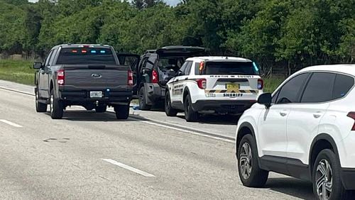 This photo provided by the Martin County Sheriff's Office shows Sheriff's vehicles surrounding an SUV on the northbound I-95 in Martin County on Sunday, Sept. 15, 2024. (Martin County Sheriff's Office via AP)